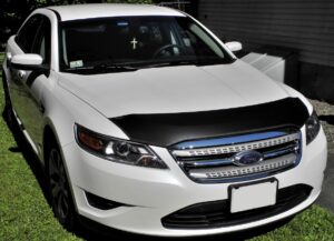 2010 Ford Taurus with a black magnetic car bra