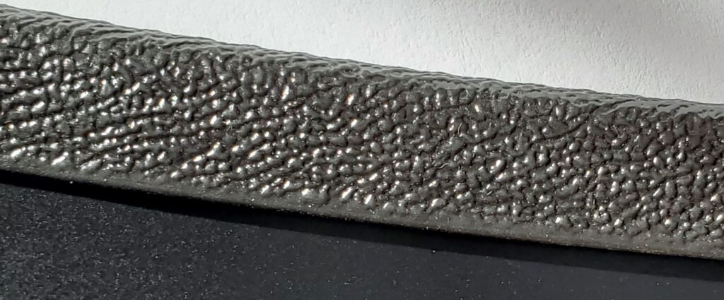 Pebble finish style trim for use with a magnetic car bra